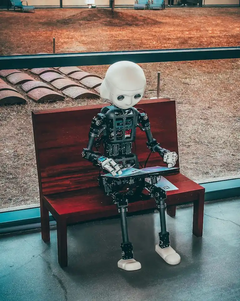 Prompt engineering workflow showing a user refining AI prompts on a laptop for better chatbot results