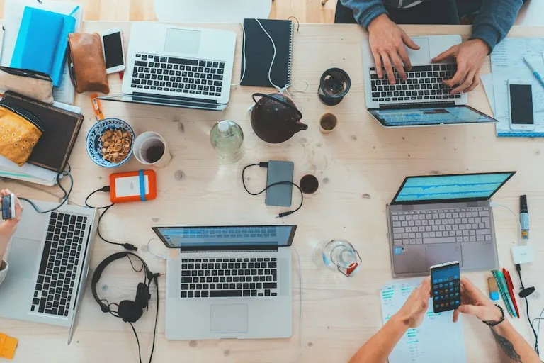 Modern tech workspace with a laptop and gadgets used for product research and recommendations